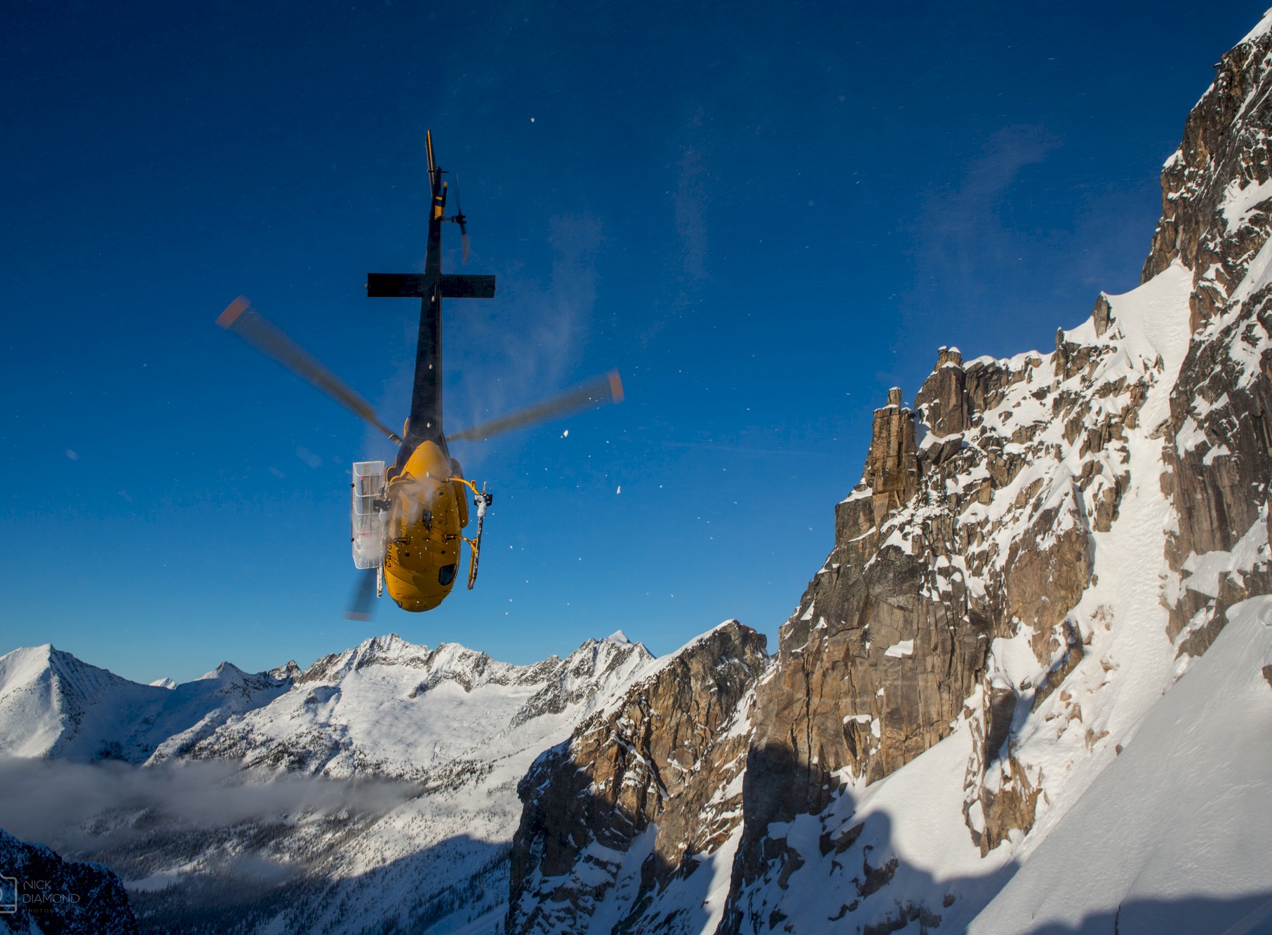 Stellar Heliskiing heli in the Purcell Mountain range.